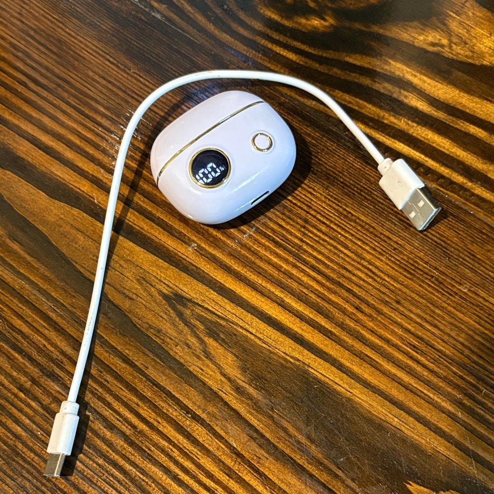 Lavender wireless earbuds with USB charger